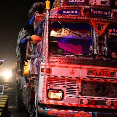 Volunteers with a cow protection squad inspect a truck on a highway in Taranagar, Rajasthan, on November 5, 2015. 