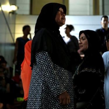 Relatives of victims of human trafficking wait for the sentence after an army general, two provincial politicians and police officers were among the 46 people held guilty in a court in Bangkok, Thailand, July 19, 2017.
