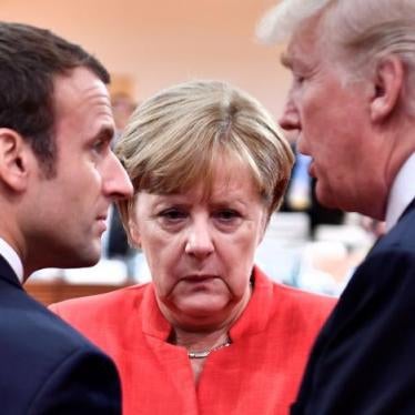 French President Emmanuel Macron, German Chancellor Angela Merkel and U.S. President Donald Trump confer at the start of the first working session of the G20 meeting in Hamburg, Germany, July 7, 2017.