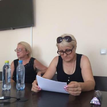 Larisa Kharkova, President of the Confederation of Independent Trade Unions of Kazakhstan (right), and her lawyer, Dina Volkova (left), seated before Khakova gives her closing statement in court on July 24, 2017. © Galym Ageleuov