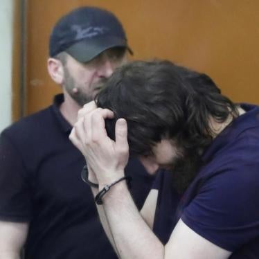 Zaur Dadayev (R) and Khamzat Bakhayev, convicted of involvement in the killing of Russian opposition leader Boris Nemtsov, stand inside the defendants' cage during their sentencing hearing at the Moscow military district court, Russia, July 13, 2017.