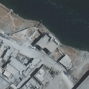 Satellite imagery from July 12 showing the building and Tigris riverbank seen in a video posted of soldiers throwing a detainee off a cliff in west Mosul as well as military vehicles in the vicinity. 