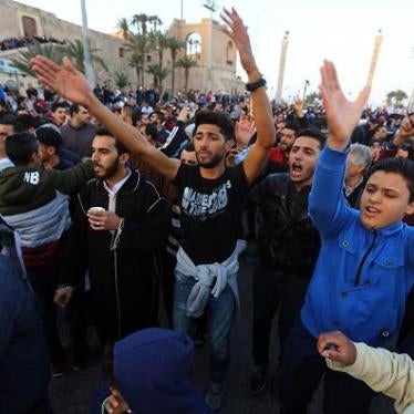Demonstrators gather to protest against the presence of militias in the Libyan capital in Tripoli's Martyrs' Square on March 17, 2017.