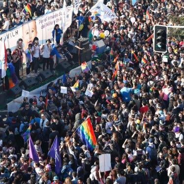 People attend a gay pride parade to demand for a new law for gender equality after Chilean President Michelle Bachelet sets marriage equality as the government's priority in Santiago, Chile July 1, 2017.