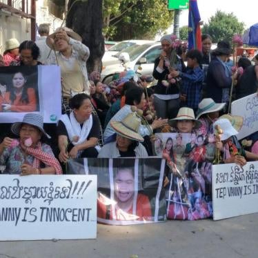 People gather outside the Appeals Court in Phnom Penh, Cambodia on August 8, 2017, holding signs of support for land rights activist, Tep Vanny. 