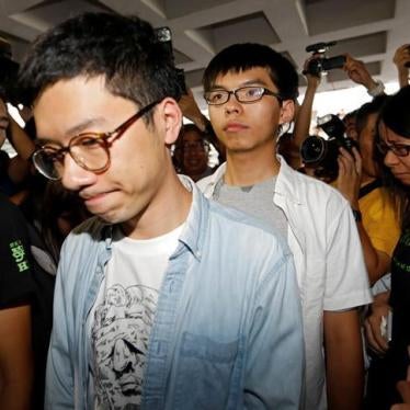 Student leaders Nathan Law and Joshua Wong walk into the high court in Hong Kong, August 17, 2017. 