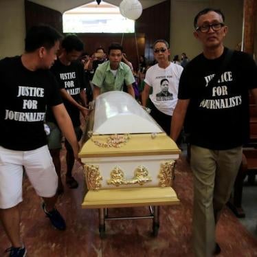 Filipino journalists escort the coffin of slain news reporter Alex Balcoba during his funeral in metro Manila, Philippines June 1, 2016.