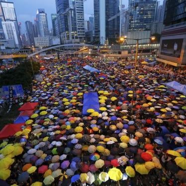 Protesters open their umbrellas, symbols of pro-democracy movement, as they mark exactly one month since they took the streets in Hong Kong's financial central district October 28, 2014.