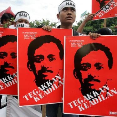 Indonesian protesters hold placards of human rights activists Munir Thalib in Jakarta December 20, 2005.
