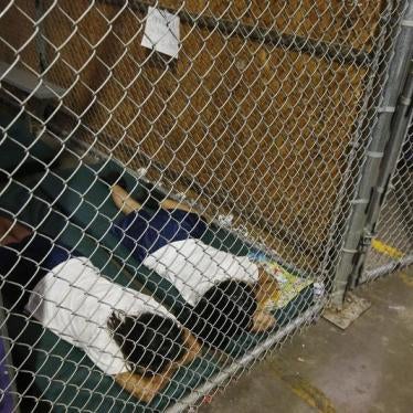 Two female detainees sleep in a holding cell at the U.S. Customs and Border Protection (CBP) Nogales Placement Center in Nogales, Arizona, in this June 18, 2014 file photo.
