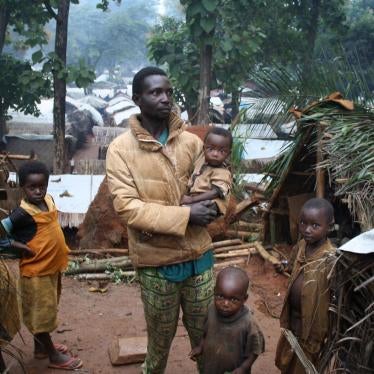 A man from the Paris-Congo neighborhood of Alindao, Basse-Kotto province, Central African Republic, with his children at the displacement camp in town, August 27, 2017. 