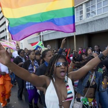 A woman holds her hands up during the Durban Pride parade where several hundred people marched through the Durban city centre in support of gay rights, July 30, 2011.