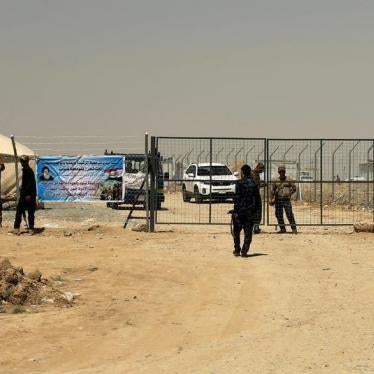 Iraqi Security Forces stand guard at the gate of a camp holding families of men suspected of being ISIS affiliates in Bartalla, east of Mosul, Iraq July 15, 2017.