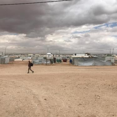 A lone man crosses Zaatari refugee camp in Jordan. The camp population fell from 203,000 during its peak in April 2013 to 80,000 by July 2017.  
