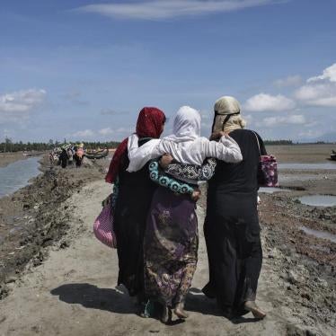 Rohingya women refugees who crossed the Naf River from Burma into Bangladesh continue inland toward refugee camps.