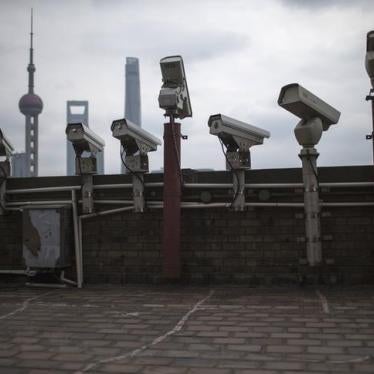 Security cameras are seen on a building at the Bund in front of the financial district of Pudong in Shanghai on March 6, 2015.