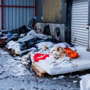 Asylum seekers and other migrants sleep outside in the snow, Calais, France, December 11, 2017. 