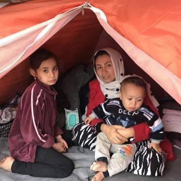 Mariam, an Afghan asylum seeker and her children in their tent in the Moria hotspot on the Greek island of Lesbos, on December 4, 2017.