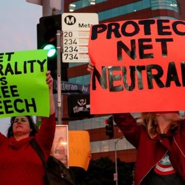 Supporter of Net Neutrality Ginger Gibson (L) of Valley Glen, California, protests the FCC's recent decision to repeal the program in Los Angeles, California, November 28, 2017.