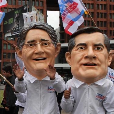 Supporters wearing masks depicting Guillermo Lasso and Andres Paez, presidential and vice-presidential candidates from the CREO party, attend an election rally in Quito, Ecuador on February 13, 2017. 