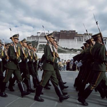 Paramilitary policemen march in formation in front of the Potala Palace during a parade around the March 10 anniversary of the failed 1959 uprising against Chinese rule, March 10, 2017.