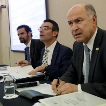 Inter-American Commission on Human Rights (IACHR) president James Cavallaro (C) and other members Paulo Abrao and Enrique Gil Botero (R) speak to the media during a news conference about the case of the missing students of Ayotzinapa Teacher Training Coll