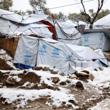 Snow lays next to tents provided by the UNHCR at the refugee camp of Moria on the Greek island of Lesbos, January 10, 2017.