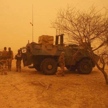 French soldiers from Operation Barkhane stand outside their armored personnel carrier during a sandstorm in Inat, Mali, May 26, 2016.