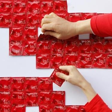 Participants work on a campaign for World AIDS Day in Seoul, South Korea, December 1, 2011.