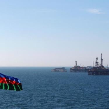 An Azerbaijan state flag flutters in the wind on an oil platform in the Caspian Sea east of Baku, January 22, 2013. 