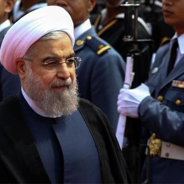 Iran's President Hassan Rouhani reviews the honor guard during a welcoming ceremony in Bangkok, October 9, 2016. 