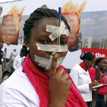 A Kenyan journalist participates in a protest in the capital, Nairobi, against draconian new laws restricting media freedom that were presented in parliament, December 3, 2013.