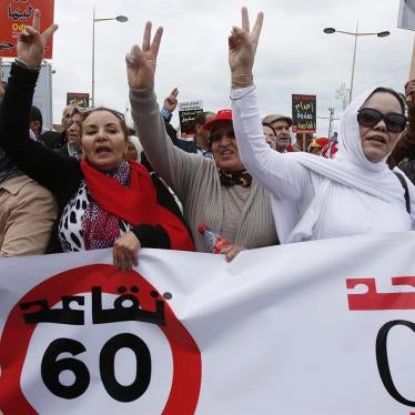Protesters take part in a demonstration called by the Democratic Labor Organization (ODT) for better working conditions and retirement in Rabat, February 7, 2016. The sign reads, "Retirement at 60".