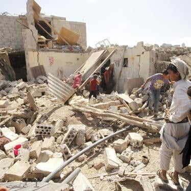 People inspect a house after it was destroyed by a Saudi-led airstrike in the capital, Sanaa, February 25, 2016. 