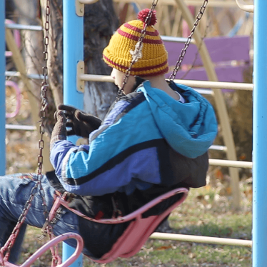 Child playing on a swing in an institution in Armenia. 