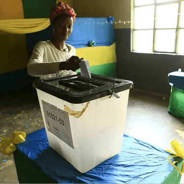 A Rwandan woman casts her vote during the December 2015 referendum to amend the Constitution to allow President Paul Kagame to seek a third term.