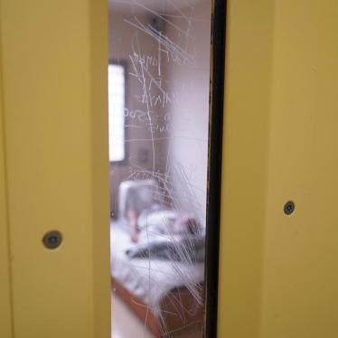 A prisoner lies in his bed in a solitary confinement cell in the safety unit at Lotus Glen Correctional Centre, northern Queensland. 