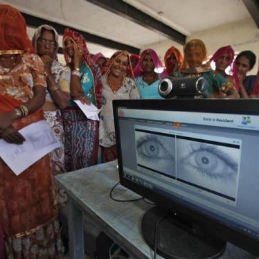 Village women stand in a queue to get themselves enrolled for the Unique Identification (UID) database system at Merta district in the desert Indian state of Rajasthan February 22, 2013. 