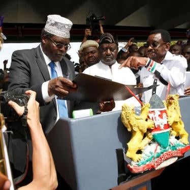 Miguna Miguna (left) partakes in Kenyan opposition leader Raila Odinga’s symbolic presidential oath of office, Nairobi, Kenya, January 30, 2018. 