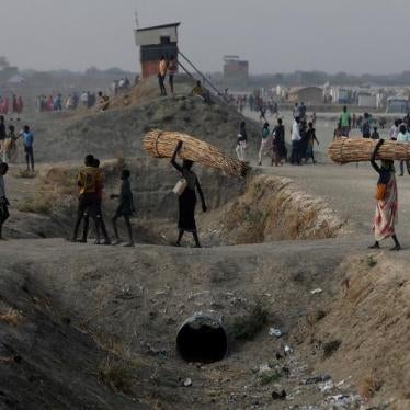 People walk inside the United Nations Mission in South Sudan (UNMISS) Protection of Civilians site (PoC), near Bentiu, northern South Sudan, February 9, 2017. 