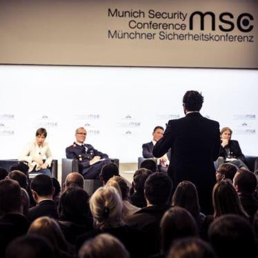 Audience members pose questions on AI and modern conflict at a town hall meeting of the Munich Security Conference in February 2018.