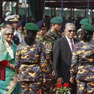 Bangladesh's President Abdul Hamid (3rd R) and Prime Minister Sheikh Hasina (2nd L) walk near female members of the Bangladesh army at the national parade ground in Dhaka on December 16, 2015. 