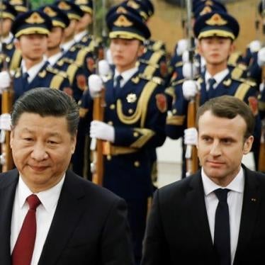 French President Emmanuel Macron and Chinese President Xi Jinping review the guard of honour during a welcoming ceremony in Beijing, China on January 9, 2018. 