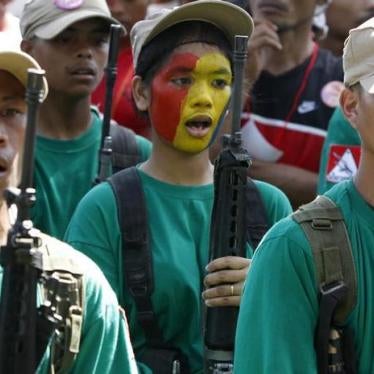New People’s Army rebels sing during an anniversary celebration in Surigao del Sur province in the southern Philippines, December 2010. 