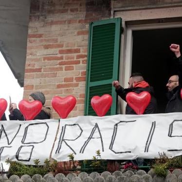 Demonstrators stand on a balcony during an anti-racism rally in Macerata, Italy, February 10, 2018. REUTERS/Yara Nardi