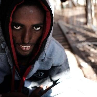 Segen, a 22-year-old Eritrean, stares into the camera before disembarking in Pozzallo, Sicily, from the Pro Activa Open Arms rescue ship on March 13, 2018. He died several hours later.