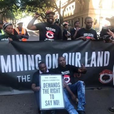 Xolobeni community members and environmental activists march and chant slogans in front of South Africa's Pretoria High Court, April 24, 2018. 