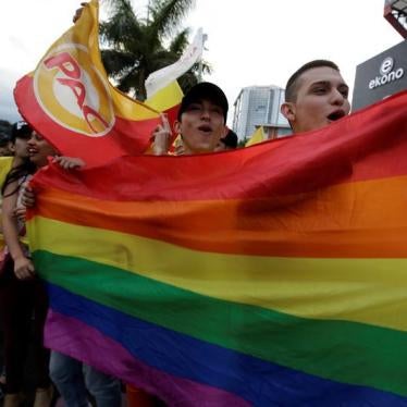 Supporters of Carlos Alvarado Quesada, presidential candidate of the ruling Citizens' Action Party (PAC), hold up a rainbow LGBT pride flag during the presidential election in San Jose, Costa Rica, April 1, 2018. 