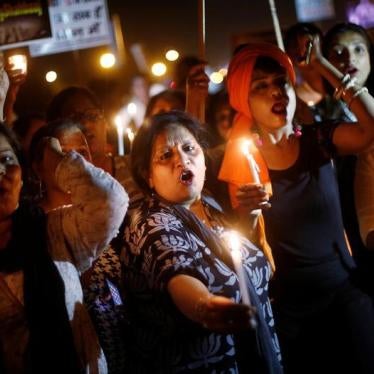 Women hold candles as they shout slogans during a protest against the rape of a ten-year-old girl, in the outskirts of Delhi, India April 25, 2018. 