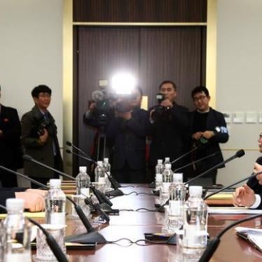 Head of the North Korean delegation, Ri Son Gwon talks with South Korean counterpart Cho Myoung-gyon during their meeting at the truce village of Panmunjom in the demilitarised zone separating the two Koreas, South Korea, January 9, 2018. 
